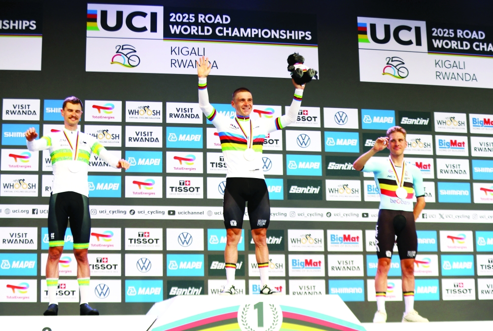 Gold medallist, Belgium's Remco Evenepoel celebrates on the podium after winning the Men's Elite Individual Time Trial alongside silver medallist, Austria's Jay Vine (L), and bronze medallist, Belgium's Ilan Van Wilde (R). — Reuters