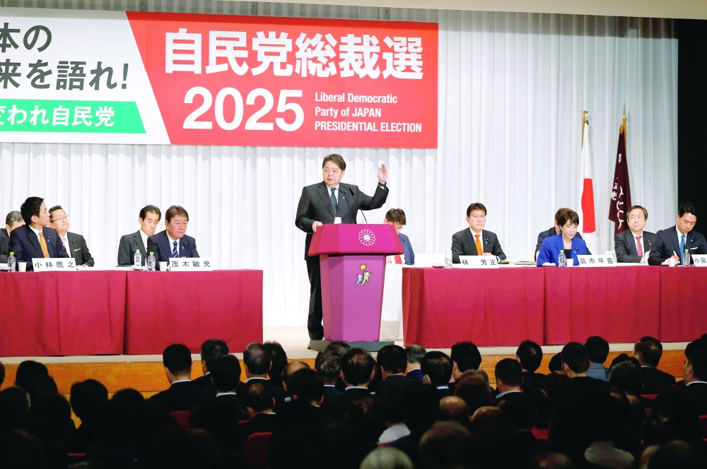 Chief Cabinet Secretary Yoshimasa Hayashi (C) delivers a speech at the kick-off of the campaign, in Tokyo. — AFP