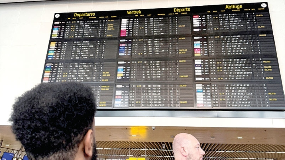 Travellers wait at Brussels airport as check-in and boarding systems disrupted operations at several major European airports, in Zaventem near Brussels, Belgium. — Reuters