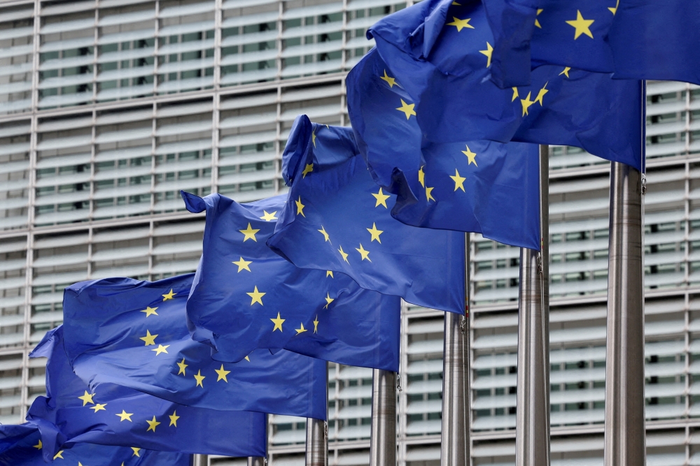 European Union flags flutter outside the EU Commission headquarters, Belgium. — Reuters