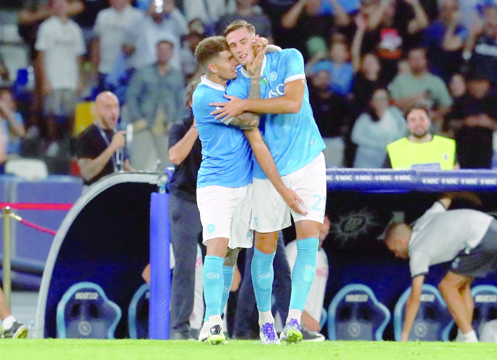 Napoli's Lorenzo Lucca (R) celebrates with Giovanni Di Lorenzo after scoring his team's third goal during the Italian Serie A match between SSC Napoli and Pisa SC at the Diego Armando Maradona Stadium in Naples. — AFP
