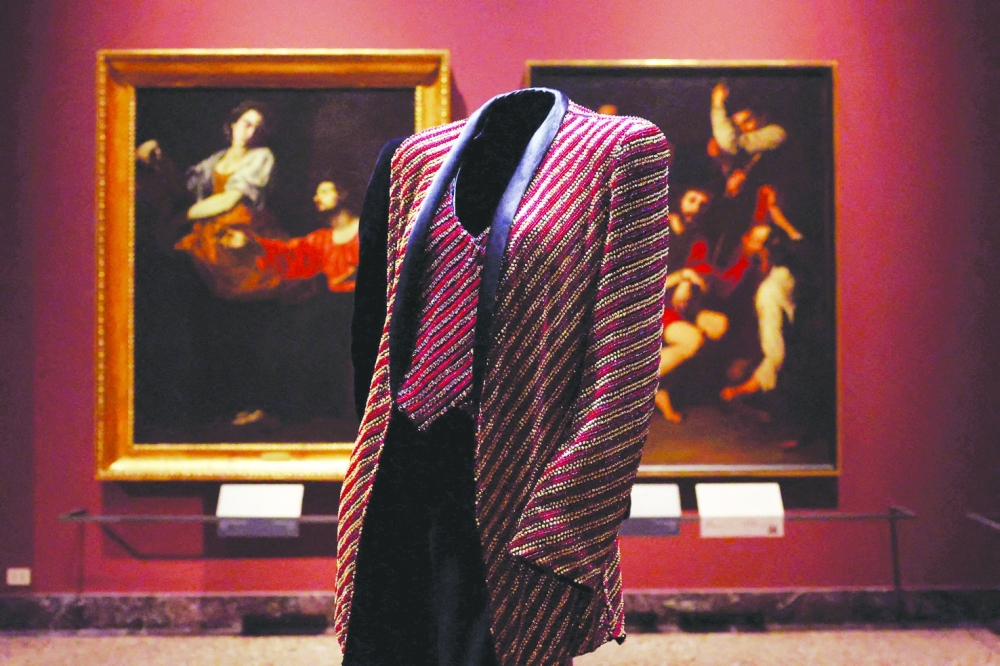 A mannequin wears archival Giorgio Armani designs, displayed among Italian art masterpieces at the Pinacoteca di Brera, in the exhibition ‘Giorgio Armani: Milano per amore’, which marks the 50th anniversary of the fashion house, during Milan Fashion Week, in Milan, Italy, September 23, 2025. REUTERS/Claudia Greco     TPX IMAGES OF THE DAY