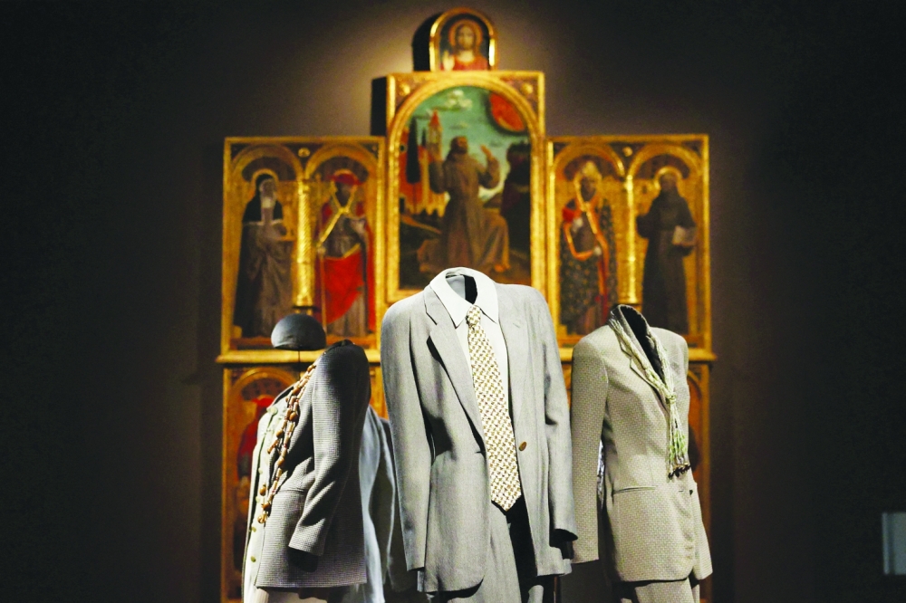 Mannequins wear archival Giorgio Armani designs, displayed among Italian art masterpieces at the Pinacoteca di Brera, in the exhibition ‘Giorgio Armani: Milano per amore’, which marks the 50th anniversary of the fashion house, during Milan Fashion Week, in Milan, Italy, September 23, 2025. REUTERS/Claudia Greco
