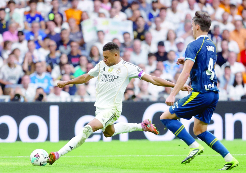 Real Madrid's French forward #10 Kylian Mbappe kicks the ball next to Espanyol's Spanish midfielder#04 Urko Gonzalez. — AFP 