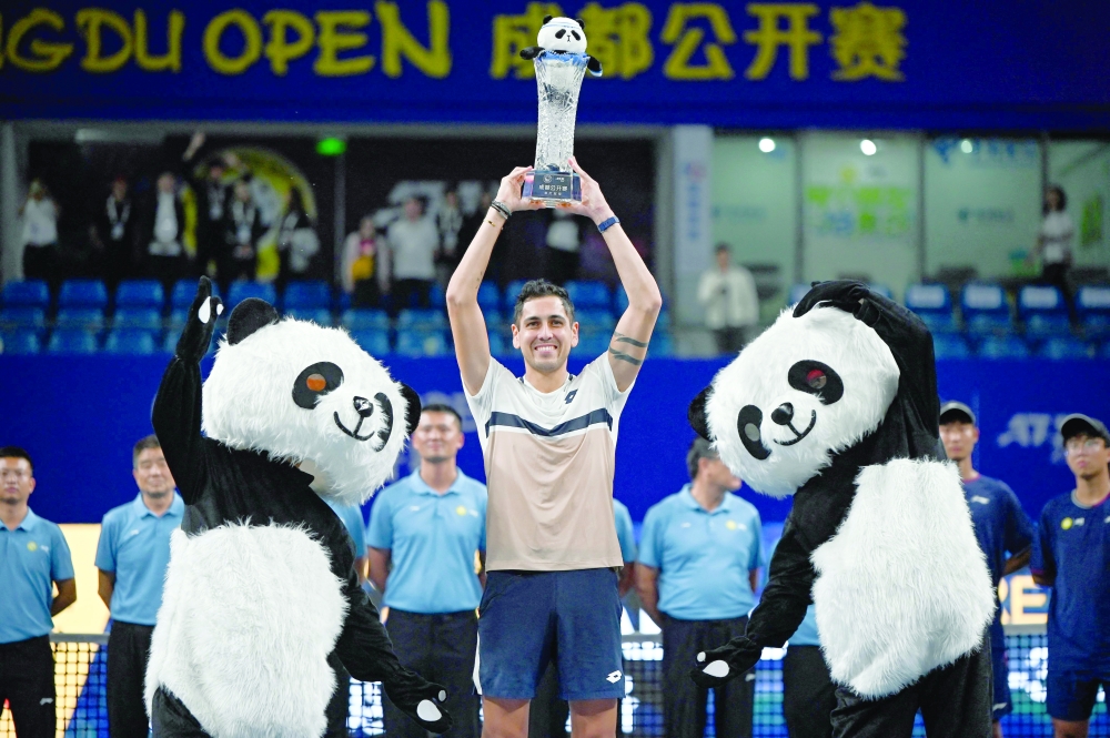 Chile's Alejandro Tabilo poses with the trophy after winning against Italy's Lorenzo Musetti during their men's singles final match at the Chengdu Open tennis tournament. — AFP
