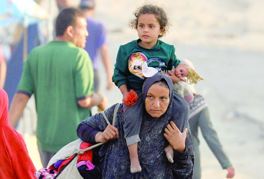 Displaced Palestinians, fleeing northern Gaza due to an Israeli military operation, move southward on Wednesday. - Reuters