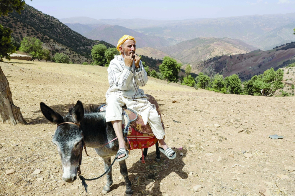 A man communicates using a whistled language, in the Atlas mountains. — AFP