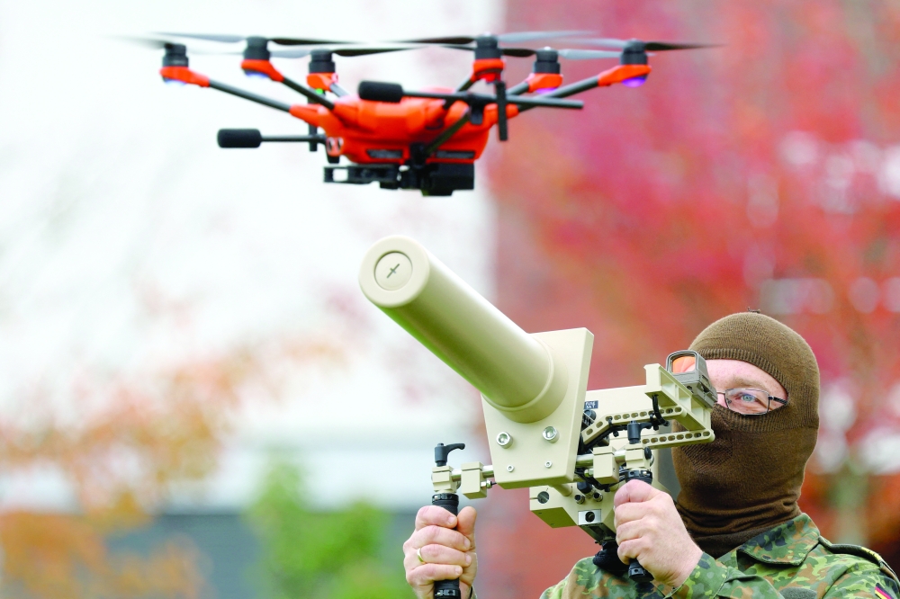 A soldier of the German armed forces demonstrates a HP 47 drone jammer during the defence exercise 'Red Storm Bravo' in which civilian and military coordination is trained and led by German army Bundeswehr in Hamburg. — Reuters