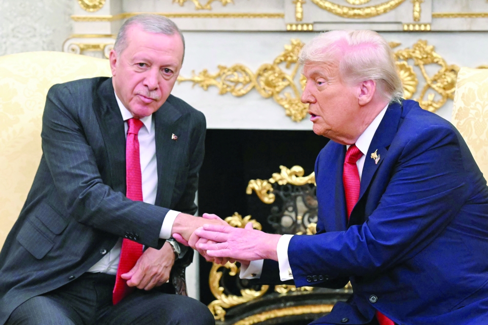 US President Donald Trump with Türkiye's President Recep Tayyip Erdogan as they meet in the Oval Office of the White House in Washington, DC. — AFP