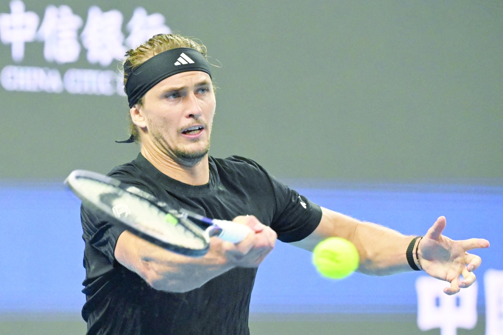 Germany's Alexander Zverev hits a return to Italy's Lorenzo Sonego during their men's singles match at the China Open tennis tournament in Beijing on September 26, 2025.  (Photo by GREG BAKER / AFP)
