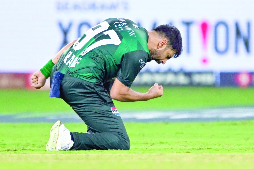 Pakistan's Haris Rauf celebrates after dismissing Bangladesh's Tanzim Hasan Sakib during the Asia Cup 2025 Super Four Twenty20 international cricket match between Bangladesh and Pakistan at the Dubai International Stadium in Dubai on September 25, 2025.  (Photo by Sajjad HUSSAIN / AFP)
