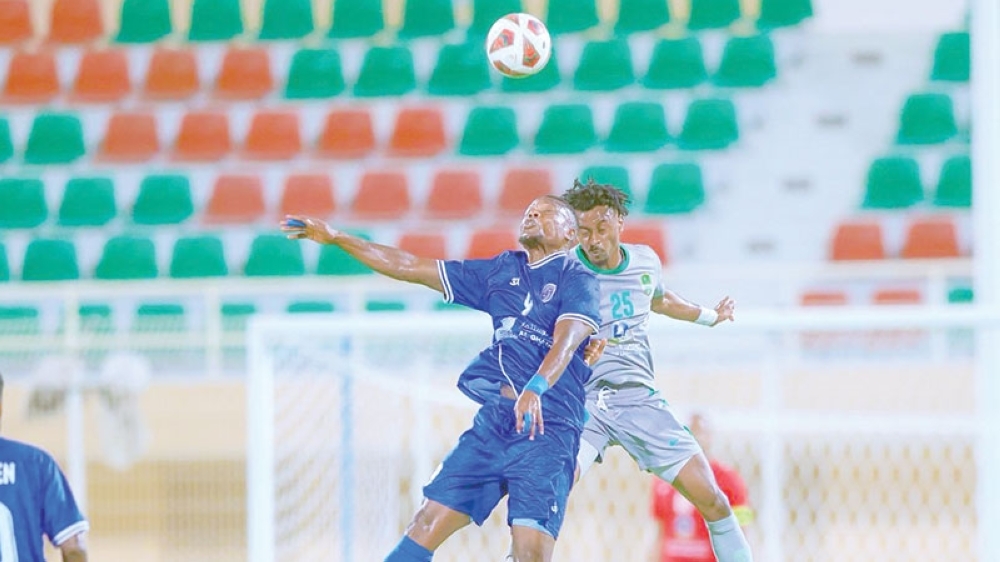 Al Nahda and Saham players fight for the ball during the Jindal League.