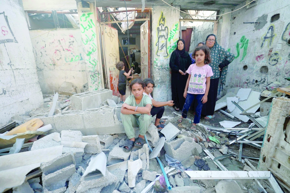 Palestinians check the damage