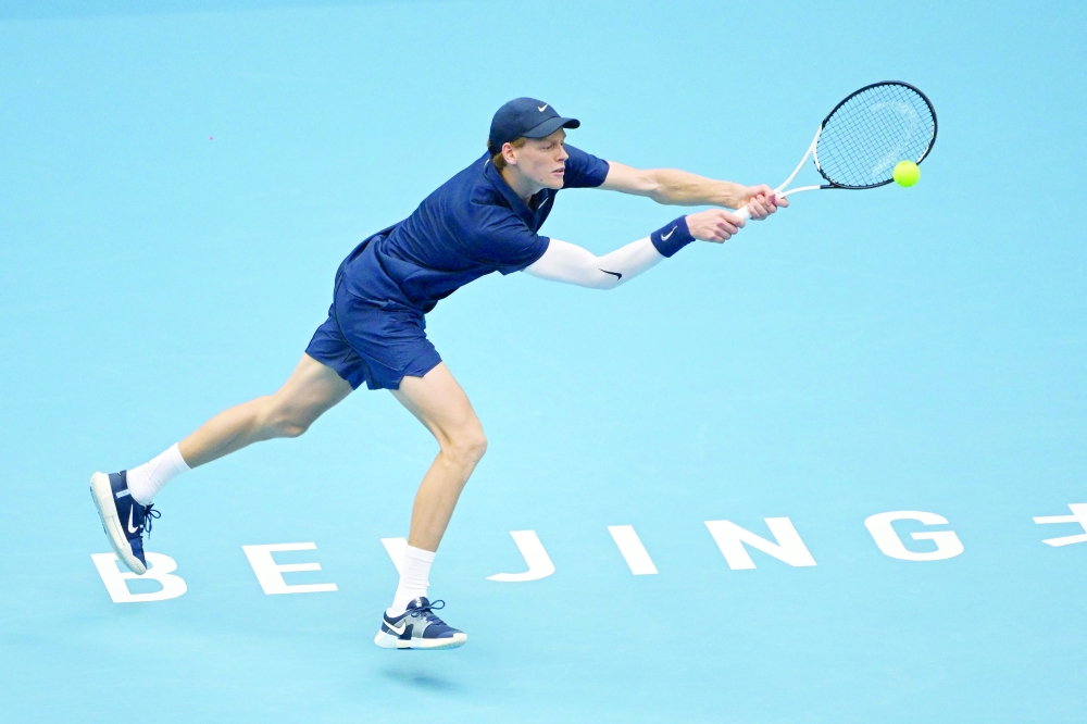 Italy's Jannik Sinner hits a return to France's Terence Atmane during their men's singles match at the China Open tennis tournament in Beijing. — AFP
