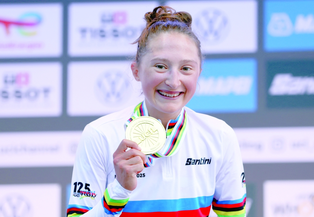 Canada's Magdeleine Vallieres celebrates winning the gold medal in the women's elite road race.— Reuters