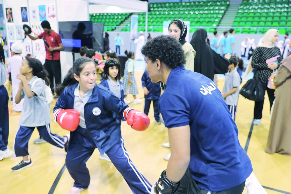 
Young participants trying out boxing during the first edition of the Amateur Sports Forum 