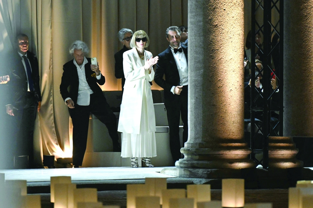 British-US fashion editor Anna Wintour and and Italian director and photographer, Francesco Carrozzini applaud at the end of the Giorgio Armani collection show at Milan's Fashion Week Womenswear Spring / Summer 2026, at the Pinacoteca di Brera Museum on September 28, 2025 in Milan.