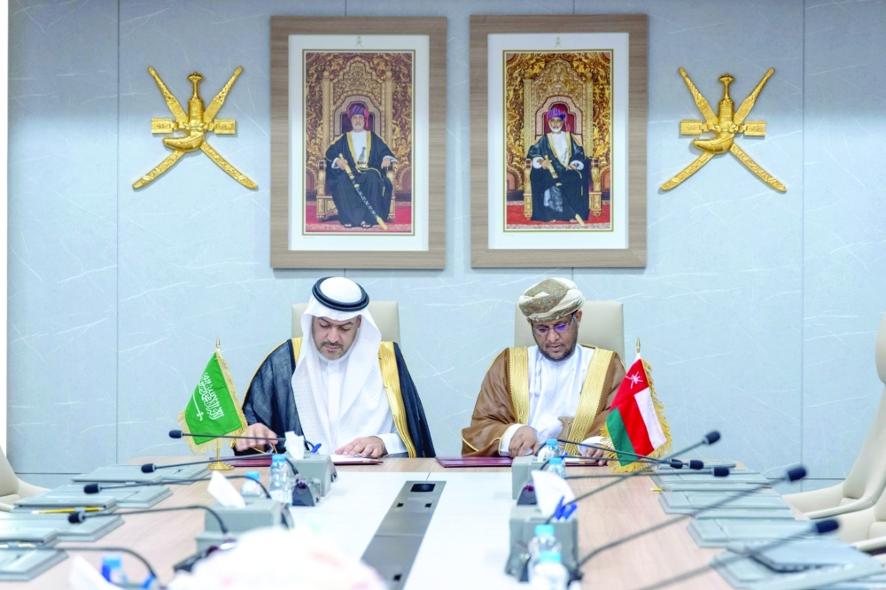 Representatives from Oman and Saudi Arabia signing the MoUs in Muscat on Monday.