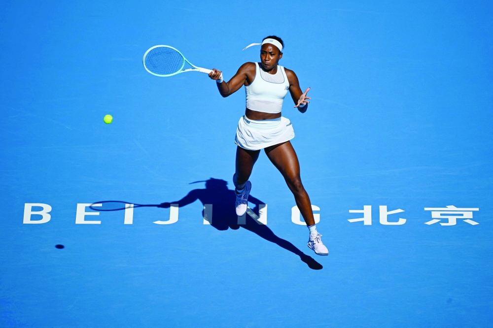 USA's Coco Gauff hits a return to Switzerland's Belinda Bencic during their women's singles match at the China Open tennis tournament in Beijing. — AFP 