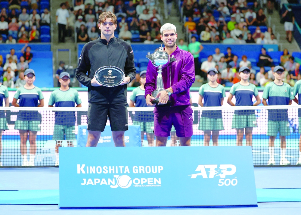 Spain's Carlos Alcaraz celebrates with the trophy after winning the final alongside runner-up Taylor Fritz of the US. — Reuters