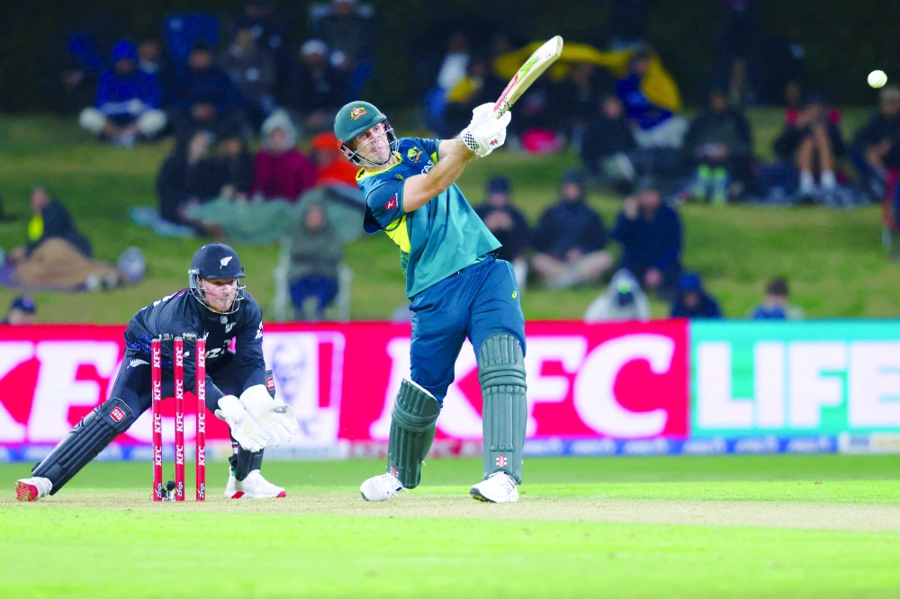Australia's Mitchell Marsh plays a shot as New Zealand's wicketkeeper Tim Seifert watches during the first Twenty20 cricket match between New Zealand and Australia at Bay Oval in Mount Maunganui. — AFP