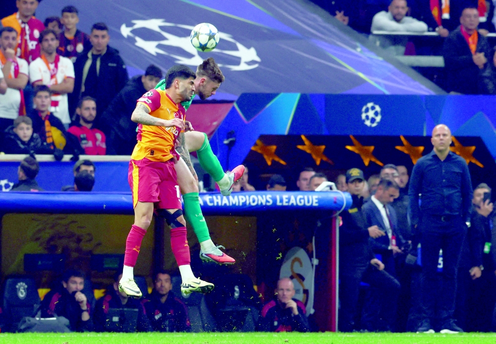  Galatasaray's Eren Elmali in action with Liverpool's Conor Bradley as Liverpool manager Arne Slot looks on. — Reuters