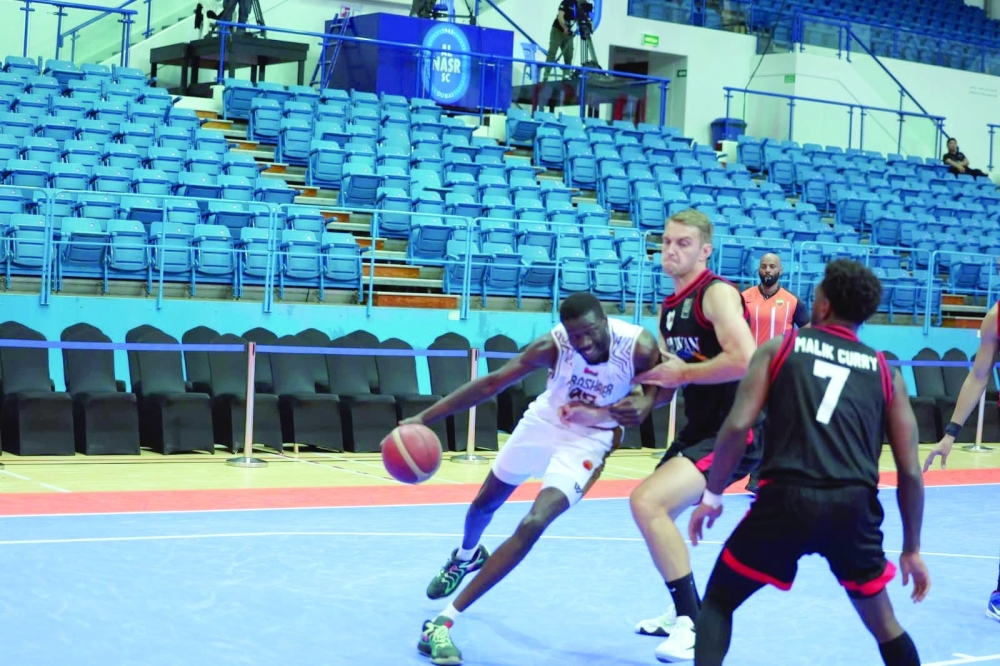 Al Bashayer and Al Rayyan players in action. 