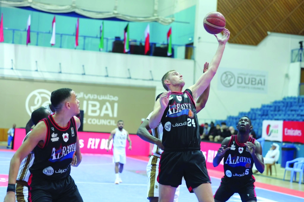 Al Bashayer and Al Rayyan players in action.