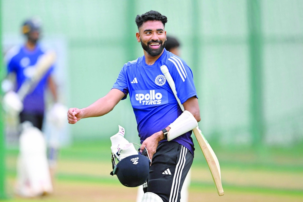India's Mohammed Siraj gestures during a practice session at the Narendra Modi Stadium in Ahmedabad on October 1, 2025, on the eve of their first cricket test match against West Indies. (Photo by R.Satish BABU / AFP)
