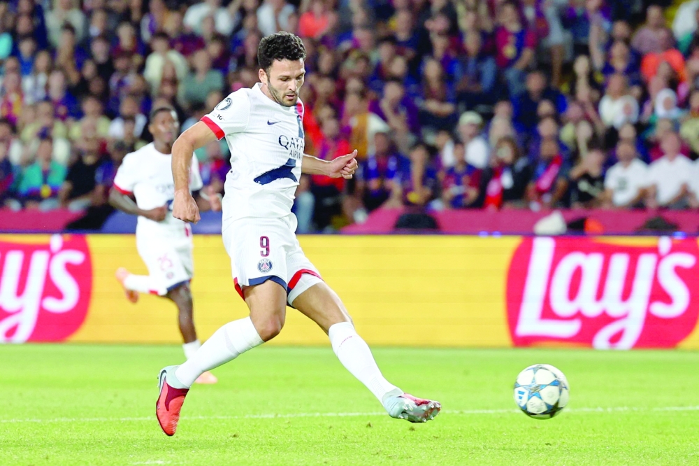 Paris Saint-Germain's Portuguese forward #09 Goncalo Ramos scores their second goal during the UEFA Champions League league phase day 2 football match between FC Barcelona and Paris Saint-Germain (PSG) at the Estadi Olimpic Lluis Companys in Barcelona, on October 1, 2025.