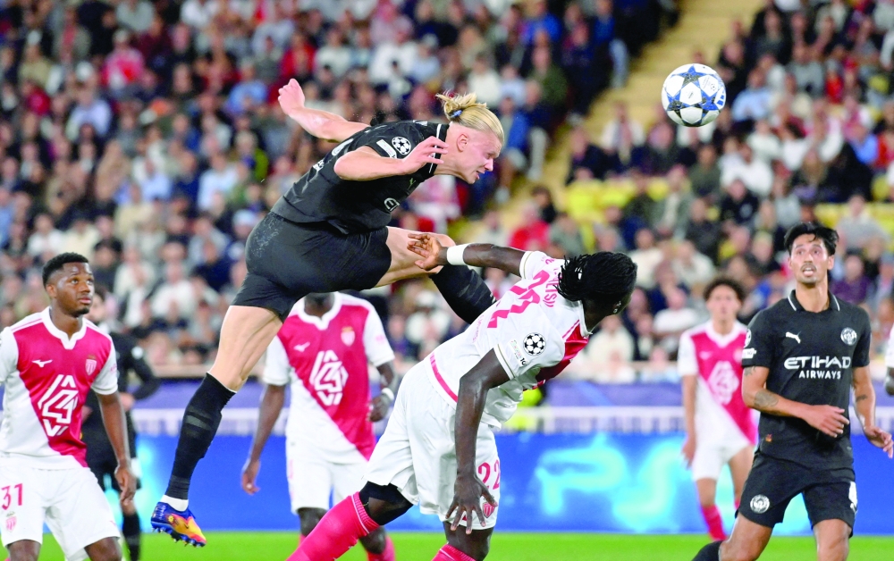 Manchester City's Erling Haaland scores their second goal against Monaco. — Reuters