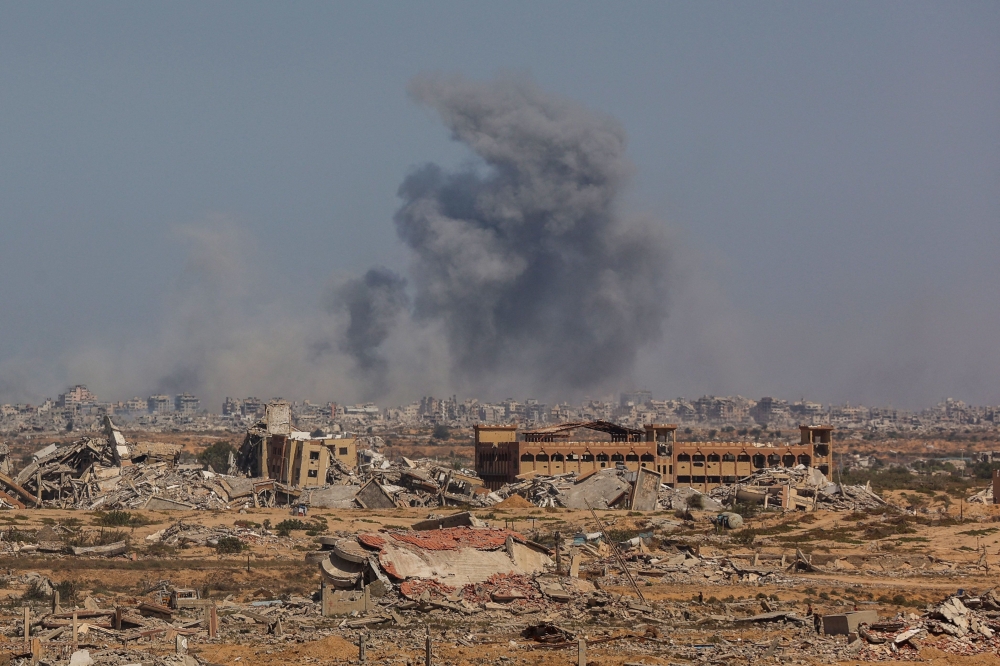 Smoke billows following an Israeli strike in Gaza City, on October 2, 2025, as pictured from Nuseirat in central Gaza