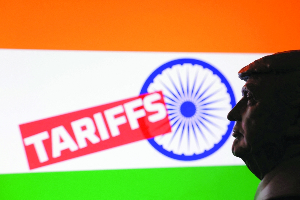A 3D-printed miniature model of U.S. President Donald Trump, the Indian flag and the word "Tariffs" are seen in this illustration taken July 23, 2025.