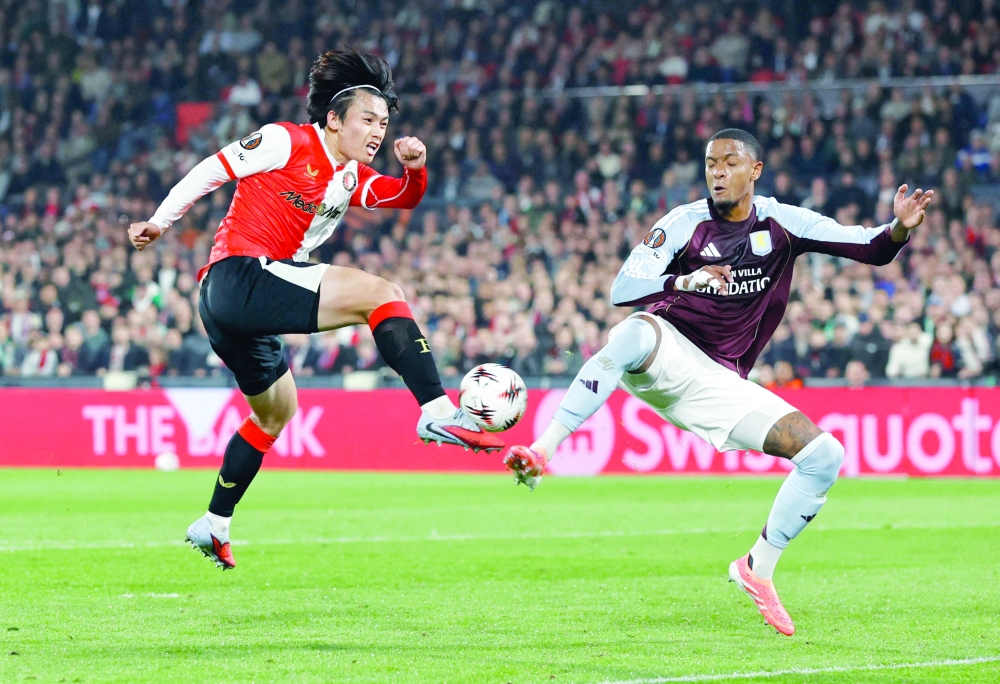 Feyenoord's Ayase Ueda in action with Aston Villa's Ezri Konsa in the Uefa Europa League match at Feyenoord Stadium, Rotterdam, Netherlands. — Reuters