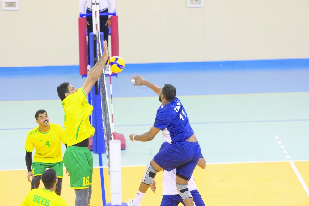 Seeb players block a smash from Taqah.