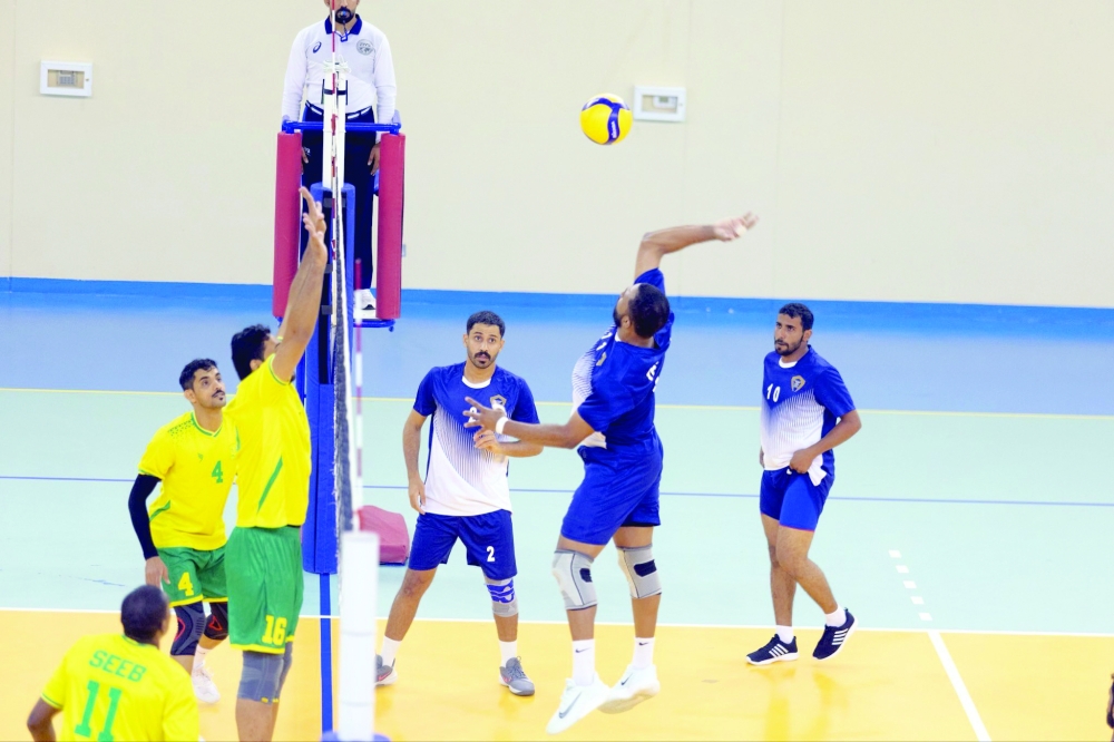 Taqah player attempts a smash against Seeb.