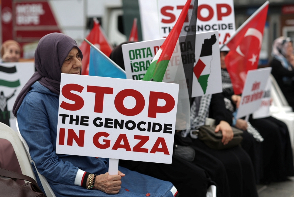 Pro-Palestinian demonstrators take part in a sit-in protest to condemn the Israeli forces' interception of the Global Sumud Flotilla vessels aiming to re