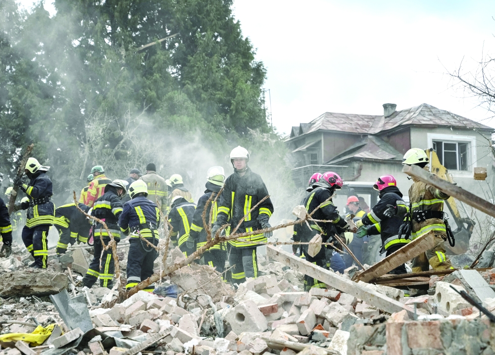 Rescuers work at the site of a house destroyed during a Russian strike, on the outskirts of Lviv. — Reuters