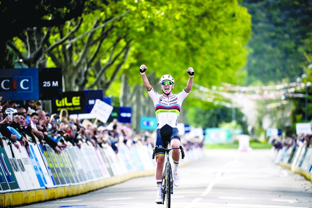 Slovenian rider Tadej Pogacar celebrates as he wins the the men's Elite Road Race at the European Cycling Championship 2025. — AFP