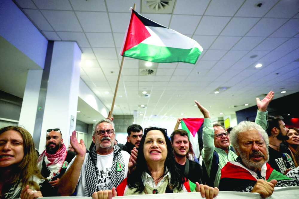 Pro-Palestinian supporters chant slogans,
