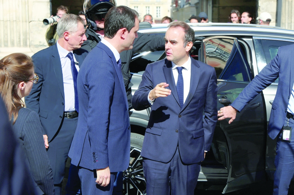 Outgoing French PM Lecornu visits a memorial tent at Place des Vosges, in Paris. — Reuters