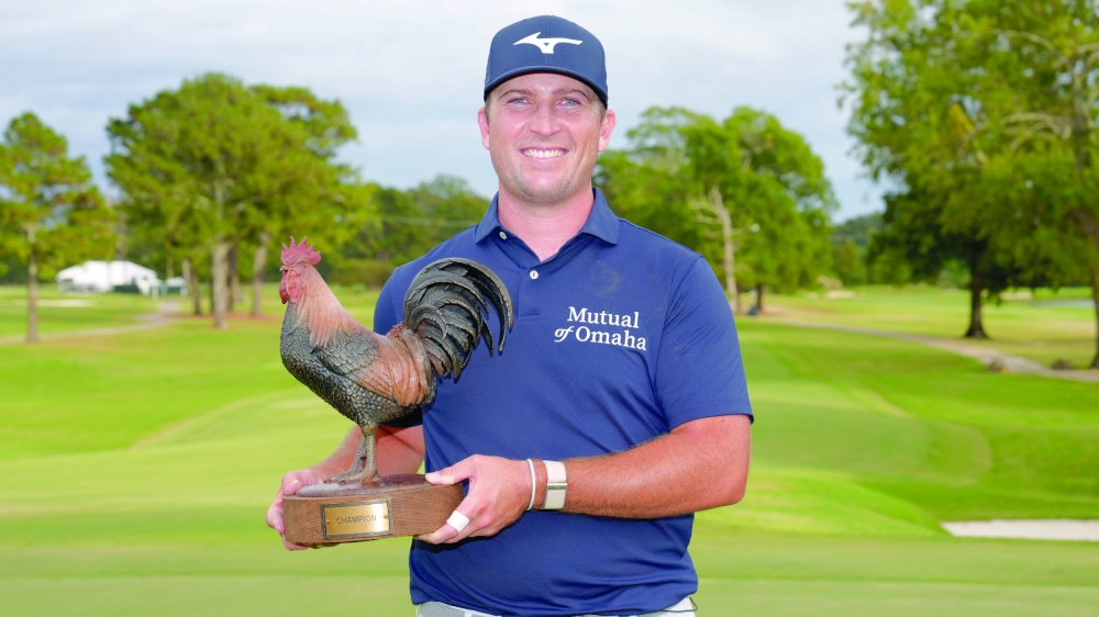Steven Fisk celebrates with the trophy after winning Sanderson Farms Championship in Mississippi.