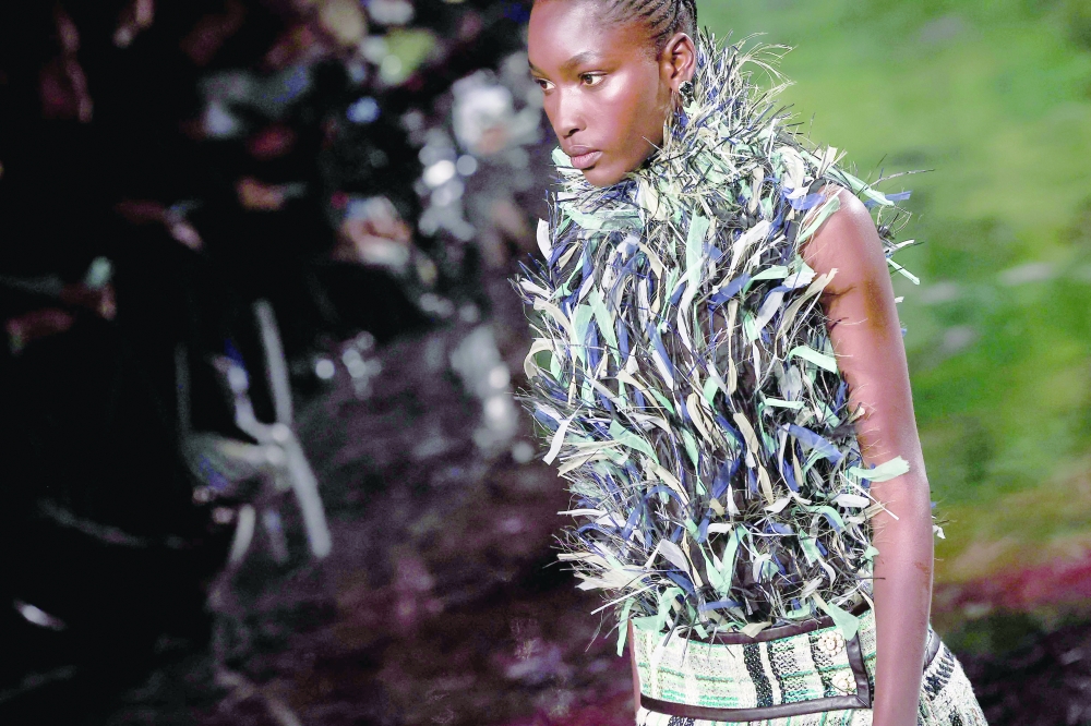A model presents a creation by Chanel for the Women Ready-to-wear Spring-Summer 2026 collection as part of the Paris Fashion Week, at the Grand Palais Ephemere in Paris on October 6, 2025. (Photo by Anne-Christine POUJOULAT / AFP)
