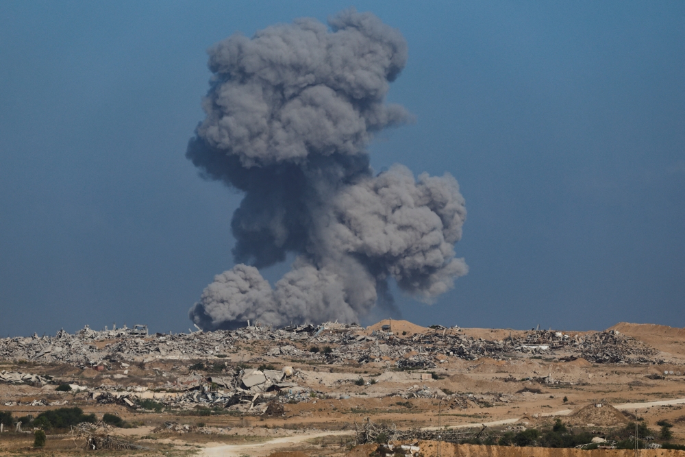 Smoke rises from Gaza after an explosion, as seen from the Israeli side of the border