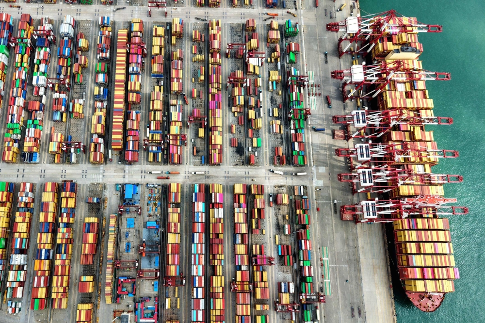 A ship is seen at the container terminal of the port in Qingdao, in China痴 eastern Shandong province 