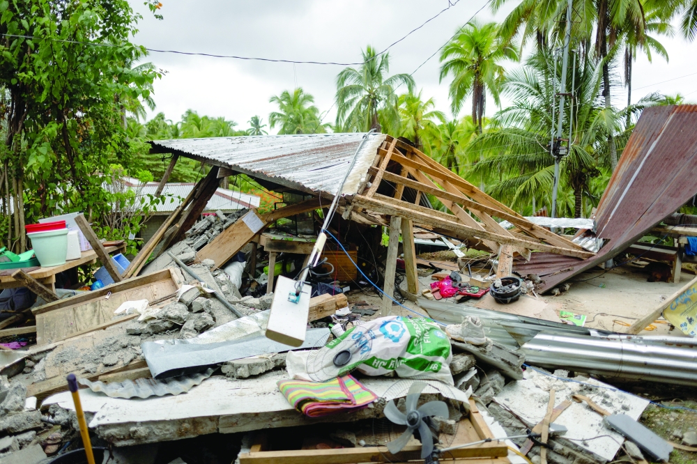The destroyed house of Pepina and Guilbert Masinading following the 7.4 magnitude quake in Manay, Davao Oriental, Philippines, October 11, 2025. REUTERS