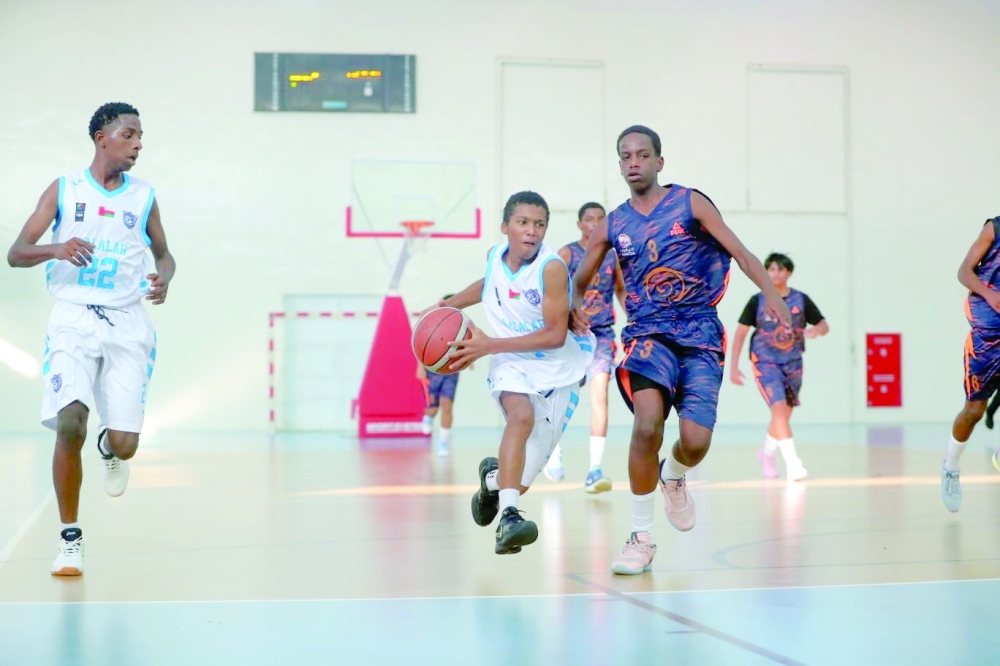 Salalah player controls the ball.