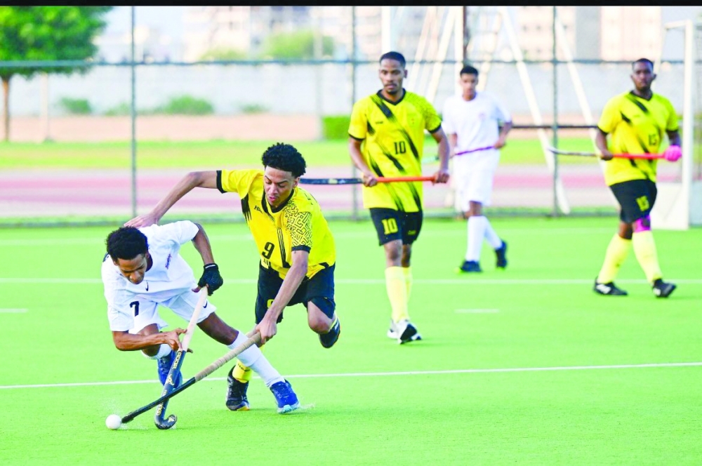 Mirbat and Fanja players fight for the ball.