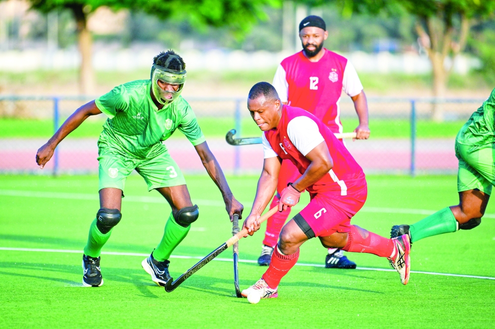  Dhofar and Al Ittihad players in action