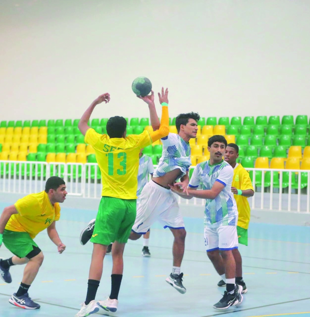 Seeb and Ahli Sidab players fight for the ball.